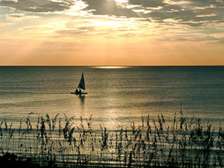 photo of a sailboat at sunset on Boca Grande Florida
